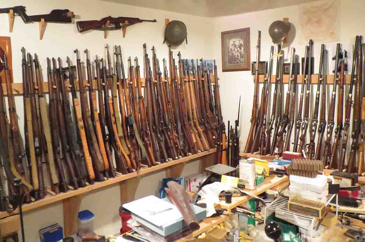 This photo of Mike’s gun vault shows only a portion of his military rifle collection.